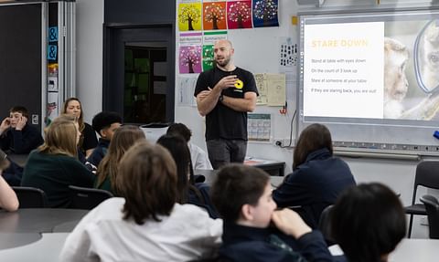 A LifeChanger mentor speaking with students in a classroom